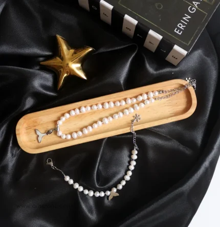 ست گردنبند و دستبند مروارید پرورشی با آویز دم وال استیل